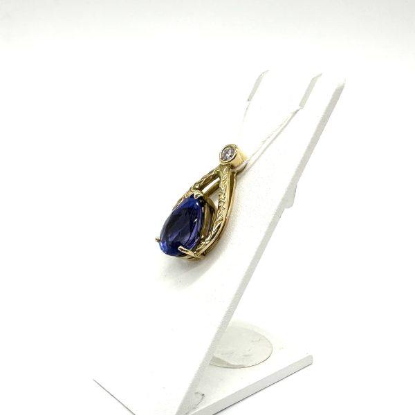 bijou occasion or jaune 750 millièmes 18 carats bijouterie frot guilde pendentif tanzanite diamant